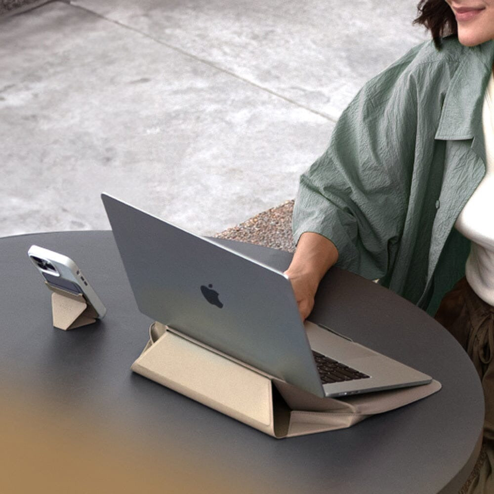 MOFT - Laptop Carry Sleeve 輕薄三合一 隱形立架筆電包 shown with a laptop on a table, demonstrating its portable design.